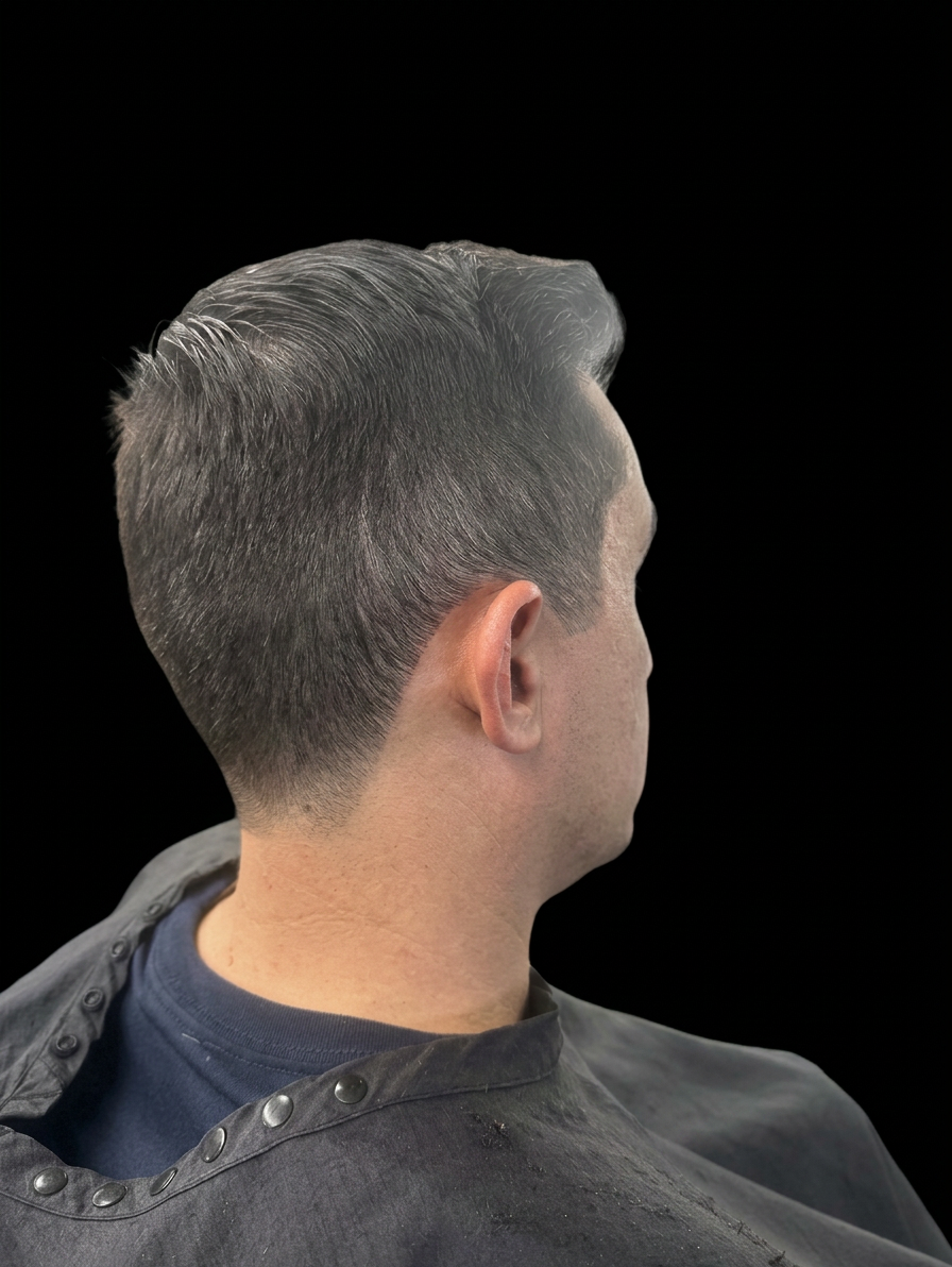 Classic gentleman's haircut viewed from the back side