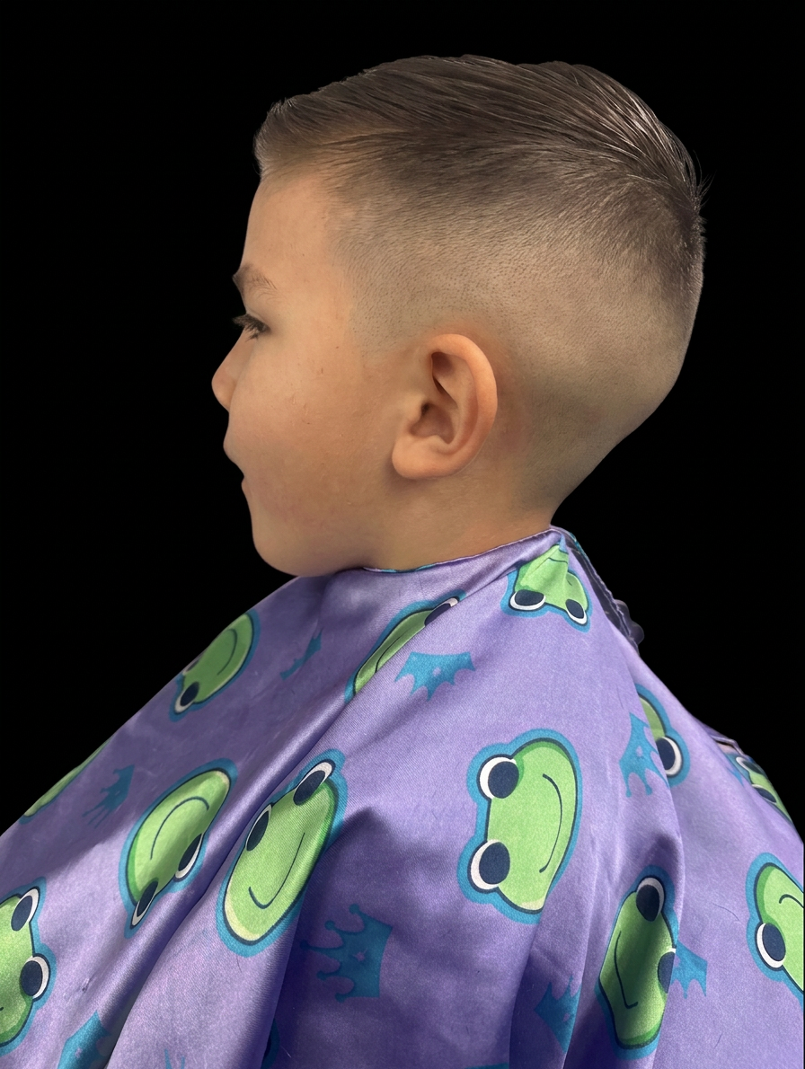 Kid's side profile haircut with clean skin fade