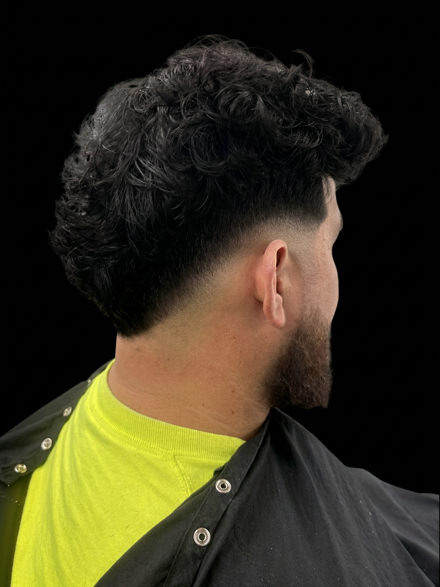 Textured curly mullet with mid fade